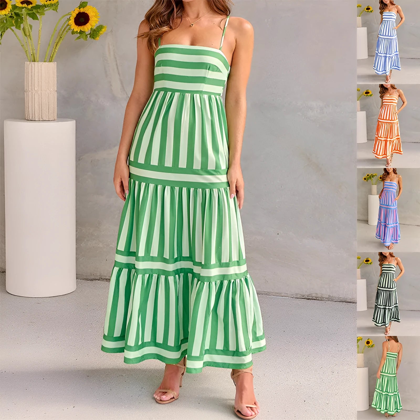 Woman wearing a striped backless suspender long dress with a square neck and side pockets.