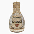 Gold rhinestone evening clutch bag shaped like a champagne bottle with a hard frame.