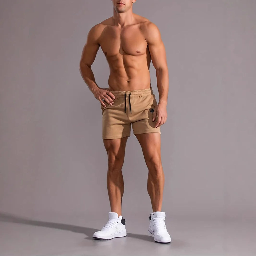 Khaki men's sports shorts with a white coconut leaf print, showing a straight leg and short length.