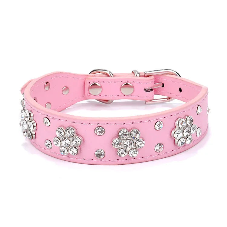 Black PU leather dog collar with silver rhinestone flower pattern and metal D-ring for small dogs.