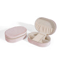 Oval velvet jewellery storage box in lake blue with flannel interior, measuring 15 by 10 cm.