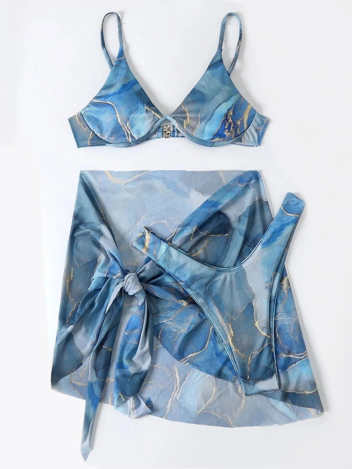 Women's marble print three-piece bikini swimwear set with skirt, bra, and panties.