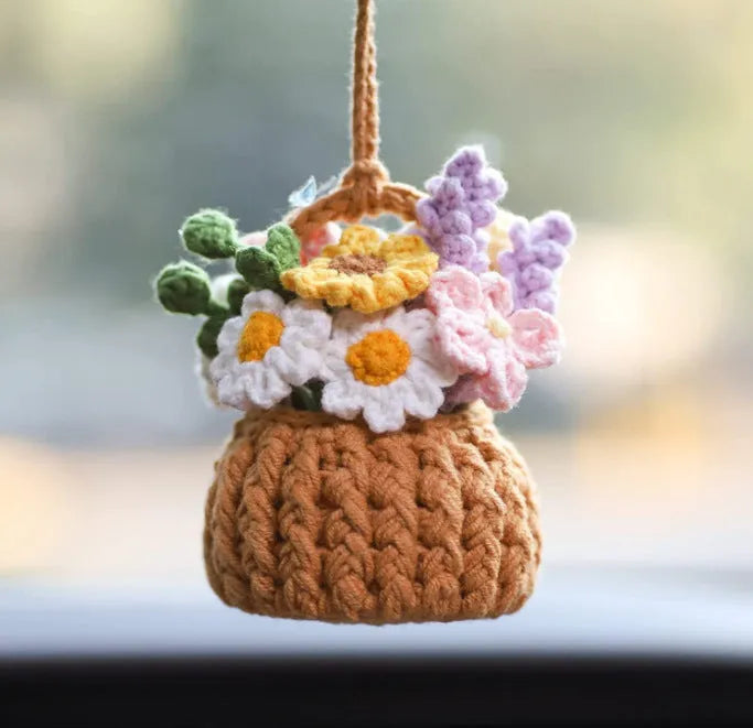 Green and white fish-scale style knitted wool car hanging planter with 8cm base and long white cord.