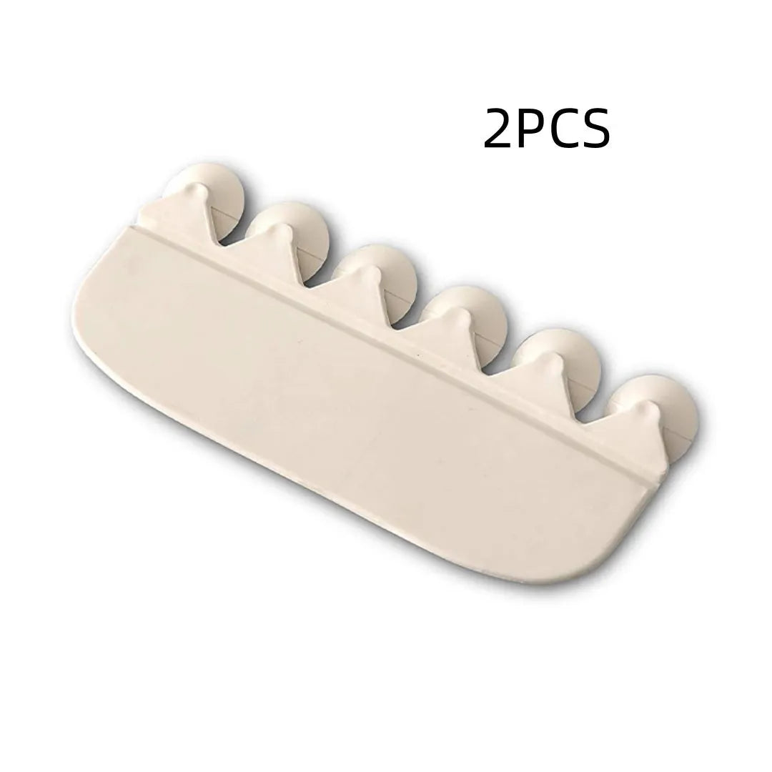 White PVC urine blocking splash guard for toilet training, shown on a toilet seat.