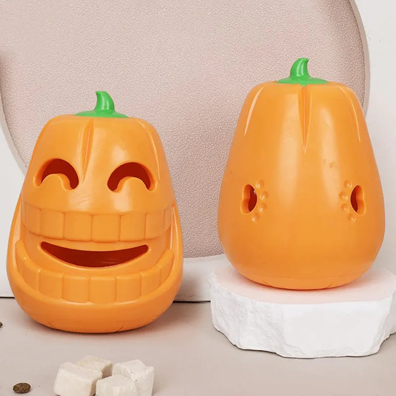 Orange Halloween pumpkin shaped dog chew toy made of durable rubber with a treat-dispensing funnel.