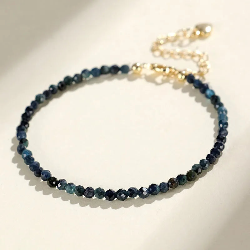 Blue tourmaline beaded bracelet with 3mm stones and spacer bead sections