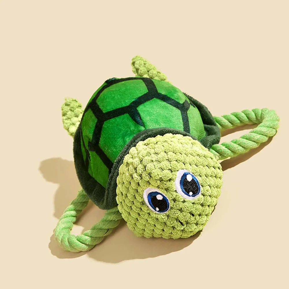 Turtle-shaped dog chewing toy with knot elements in grey green orange colours for medium large dogs