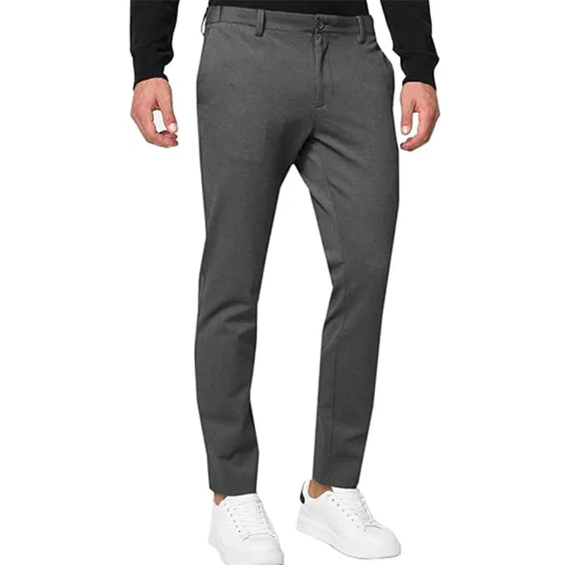 Men's slim-fit tapered chino trousers in Army Green colour, showing zipper fly and casual styling.