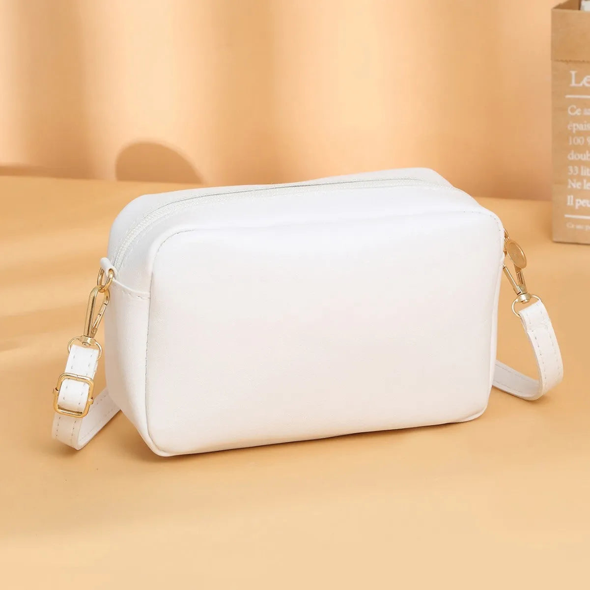 Solid colour minimalist ladies shoulder bag in PU leather with a three-dimensional pocket