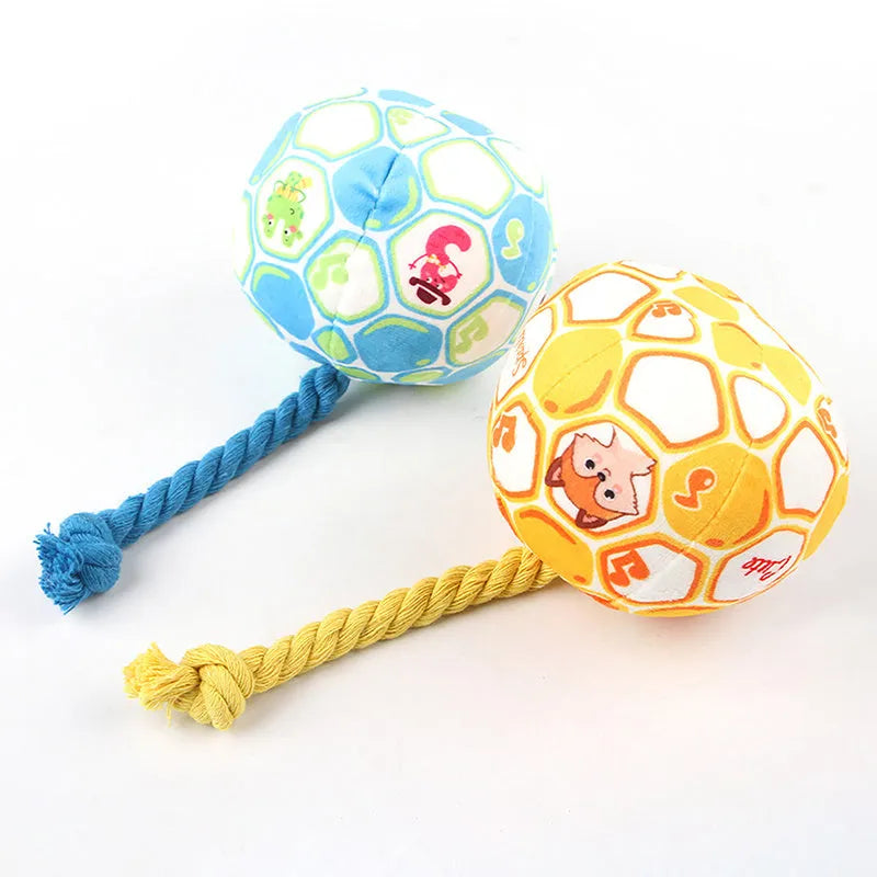 Blue and yellow elastic football dog toy with cotton rope construction for teeth grinding and interactive play
