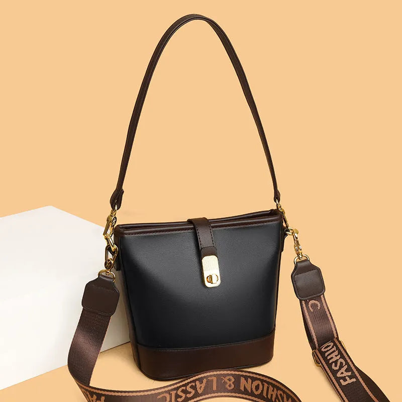 Korean style soft PU bucket messenger bag with double shoulder straps in black colour showing sandwich pocket and sewing thread details