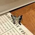 Women's butterfly design ring made from copper with an oil-drip finish, showing one of 33 colour variants.