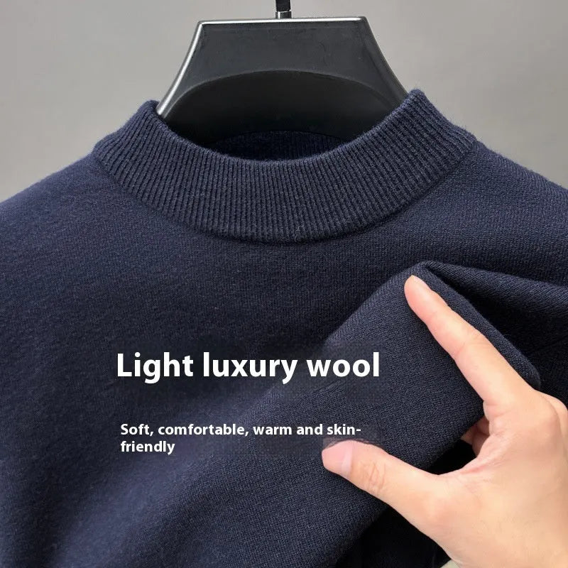 Men's fine wool half turtleneck sweater in a solid colour, showing long sleeves and regular fit.