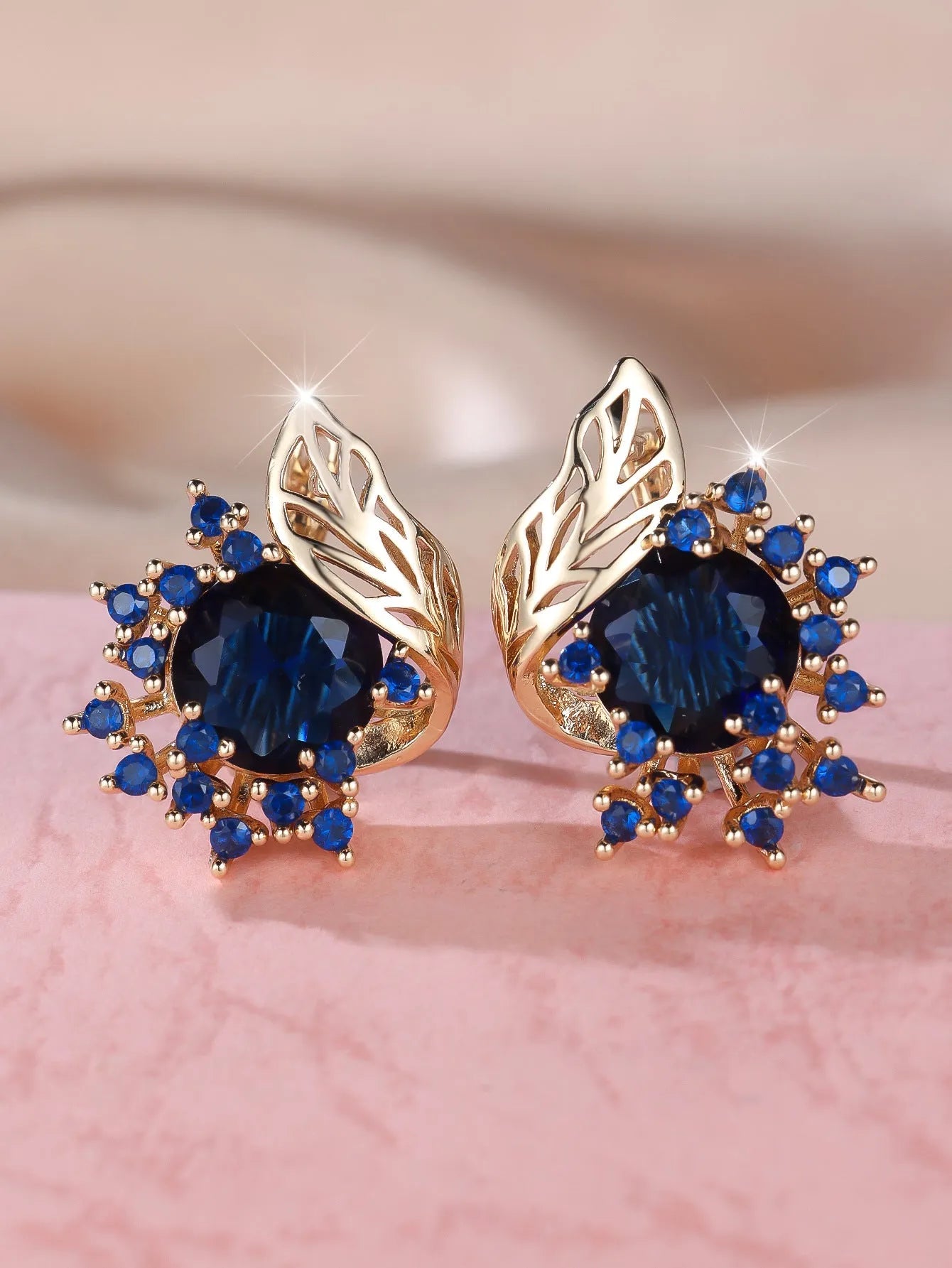Round flower feather earrings with zircon crystals in electroplated champagne gold colour