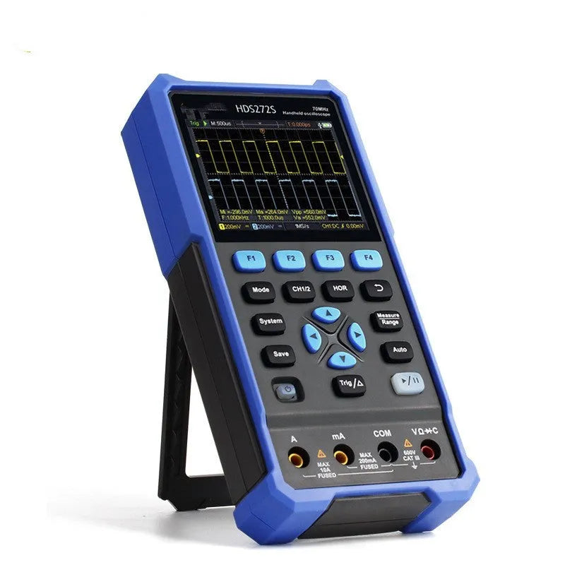 Handheld digital oscilloscope with probe on workbench for automotive electrical testing.