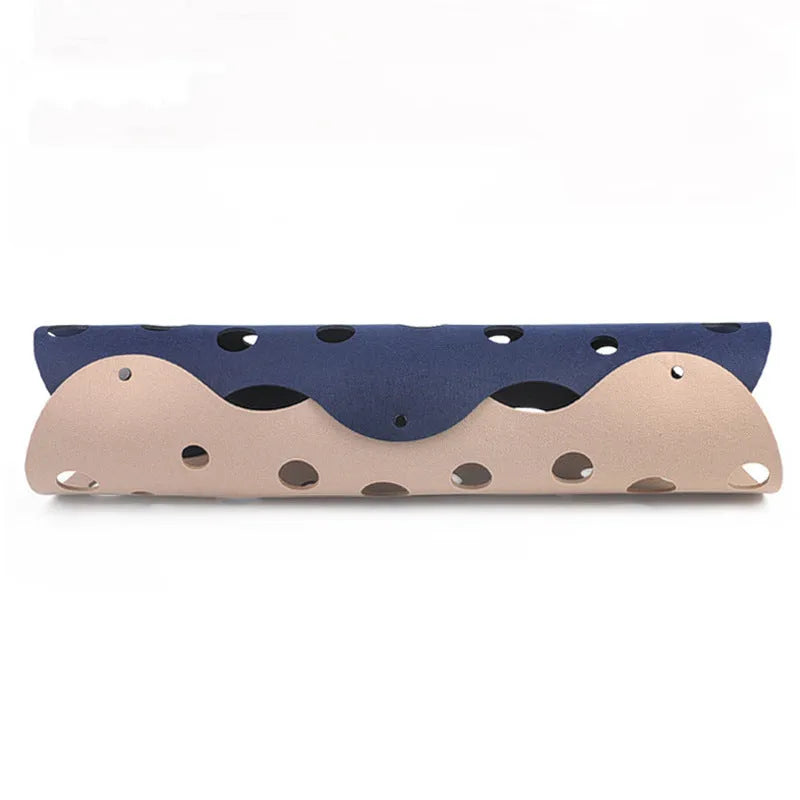 Deformable felt cat tunnel with peepholes in cement grey and orange, assembled on floor