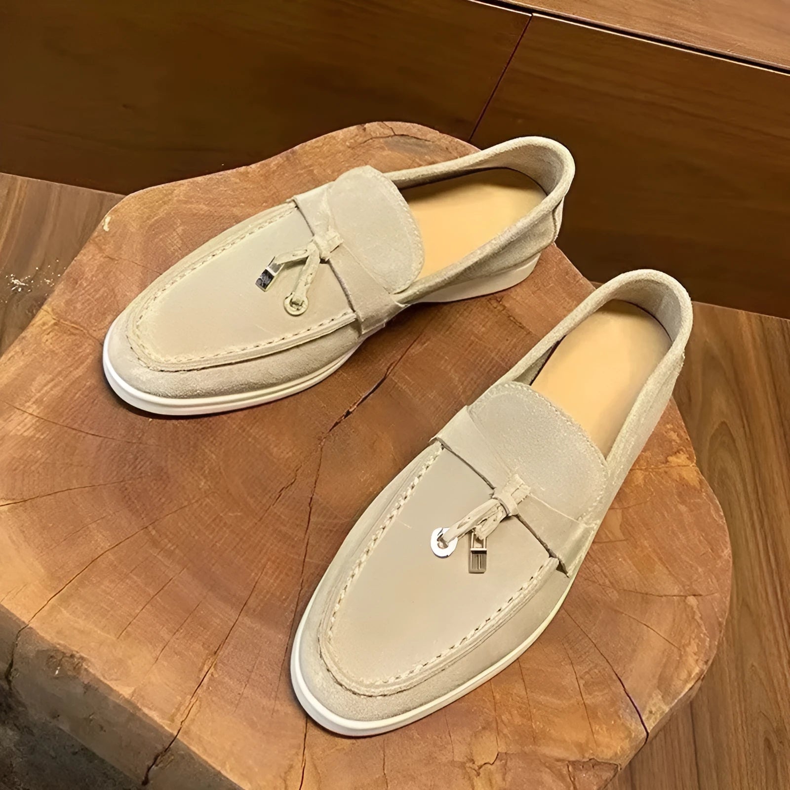 Unisex black slip-on casual loafers with rubber sole and round toe cap on a white background