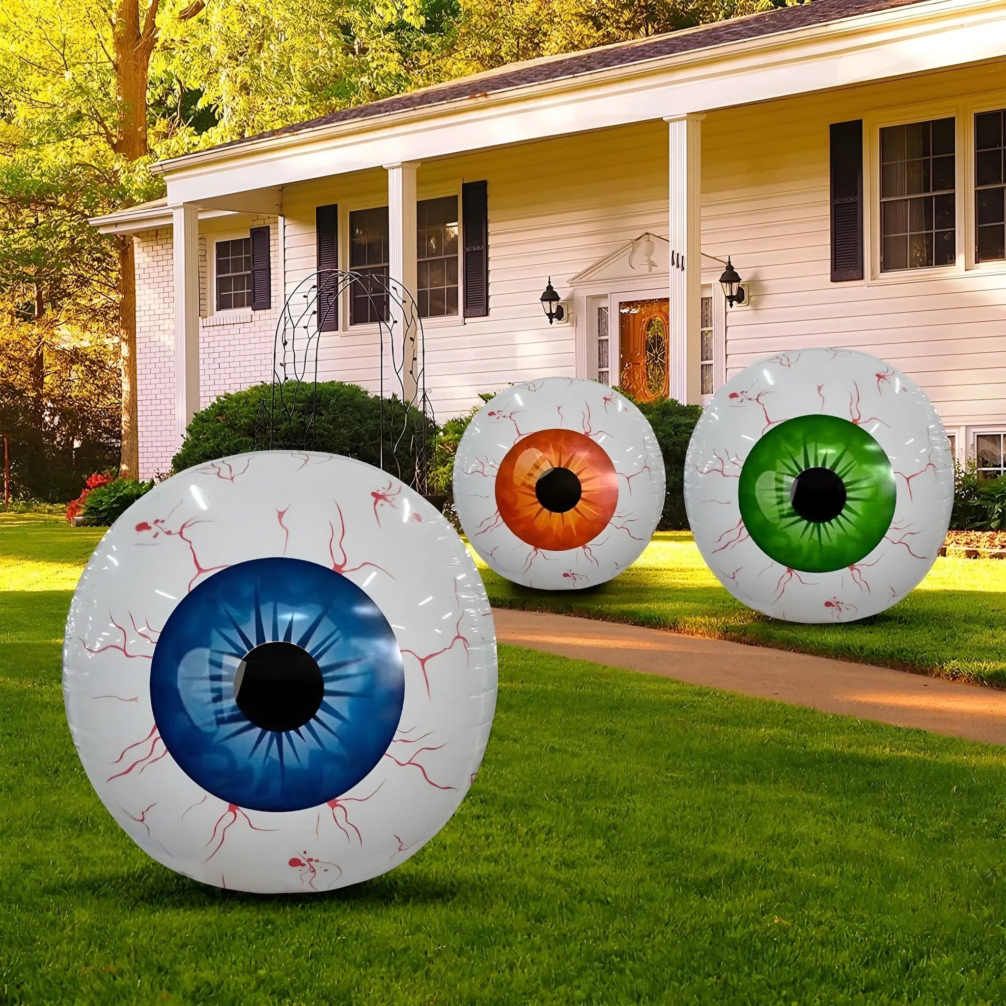 Green Halloween balloon with detailed bloodshot eyeball design, shown inflated.