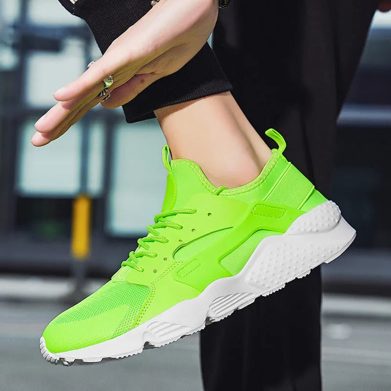 Men's green mesh low-top casual shoes with front laces and cross shoulder straps on a flat MD sole.
