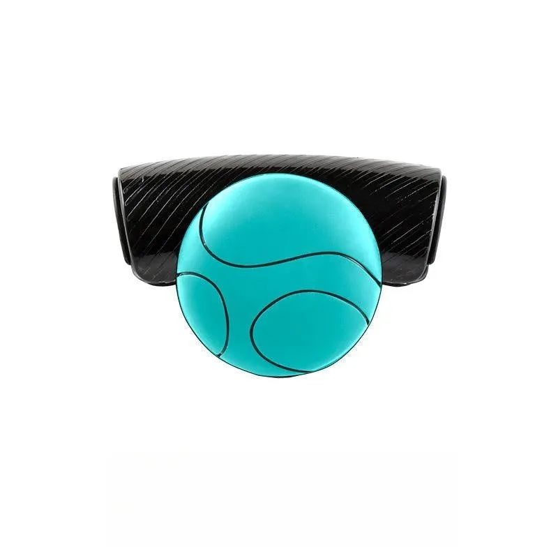 Black silicone steering wheel assist ball with metal bearing, shown next to a blue version.