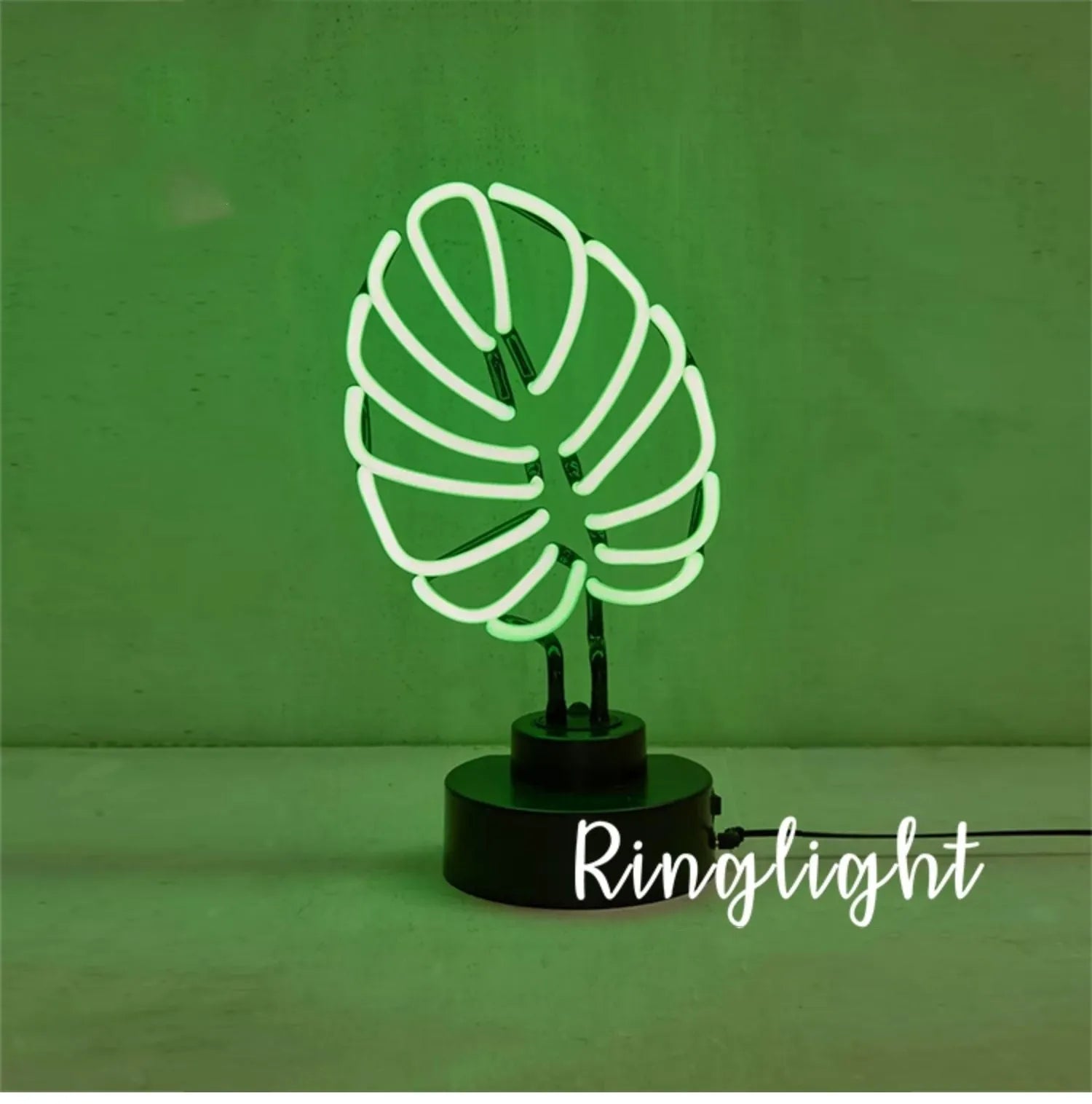 Minimalist bamboo-shaped desktop lamp with white tube emitting green light, USB powered