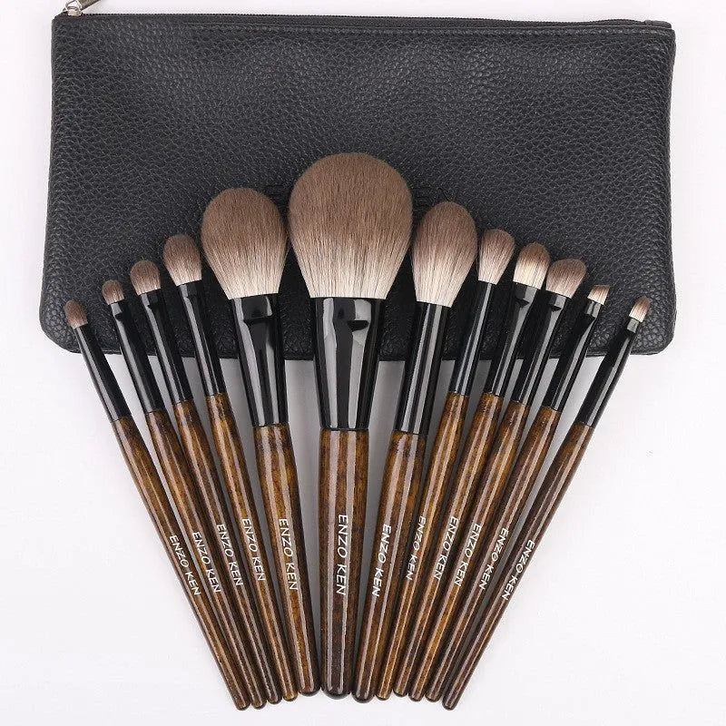 12-piece makeup brush set with wooden handles and a grey PU storage bag