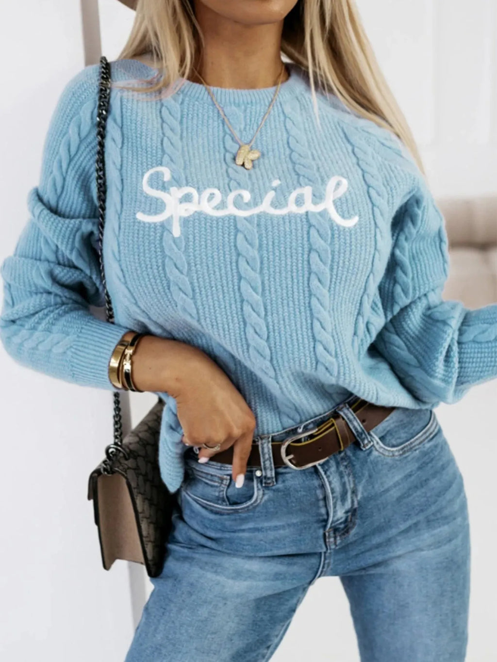 Blue leisure pullover sweatshirt with white embroidered letter design on the front.