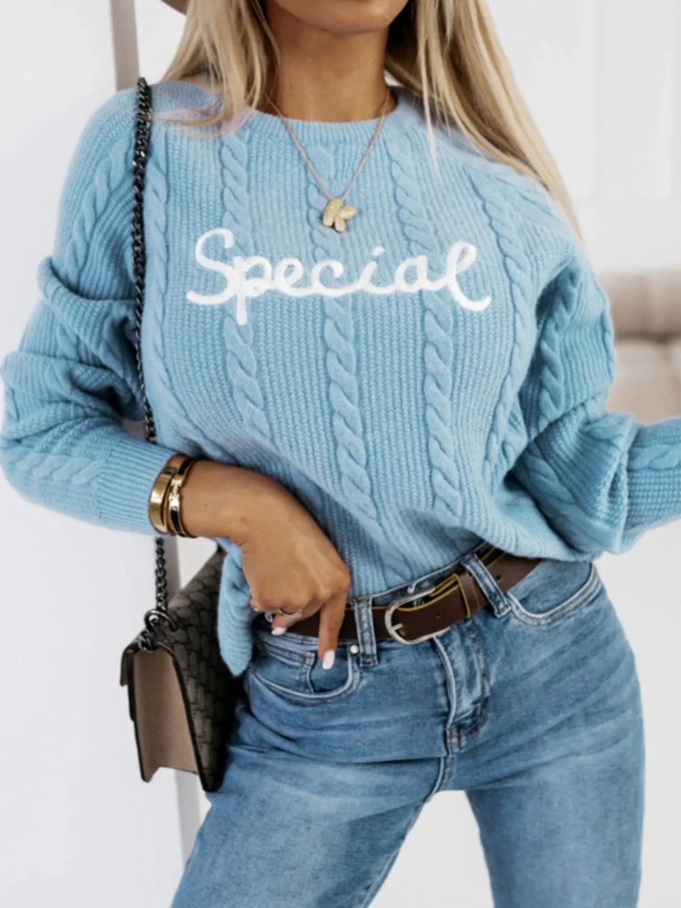 Blue leisure pullover sweatshirt with white embroidered letter design on the front.