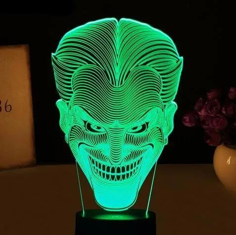 3D acrylic LED lamp showing colourful illumination on a square base, with remote control and USB cable