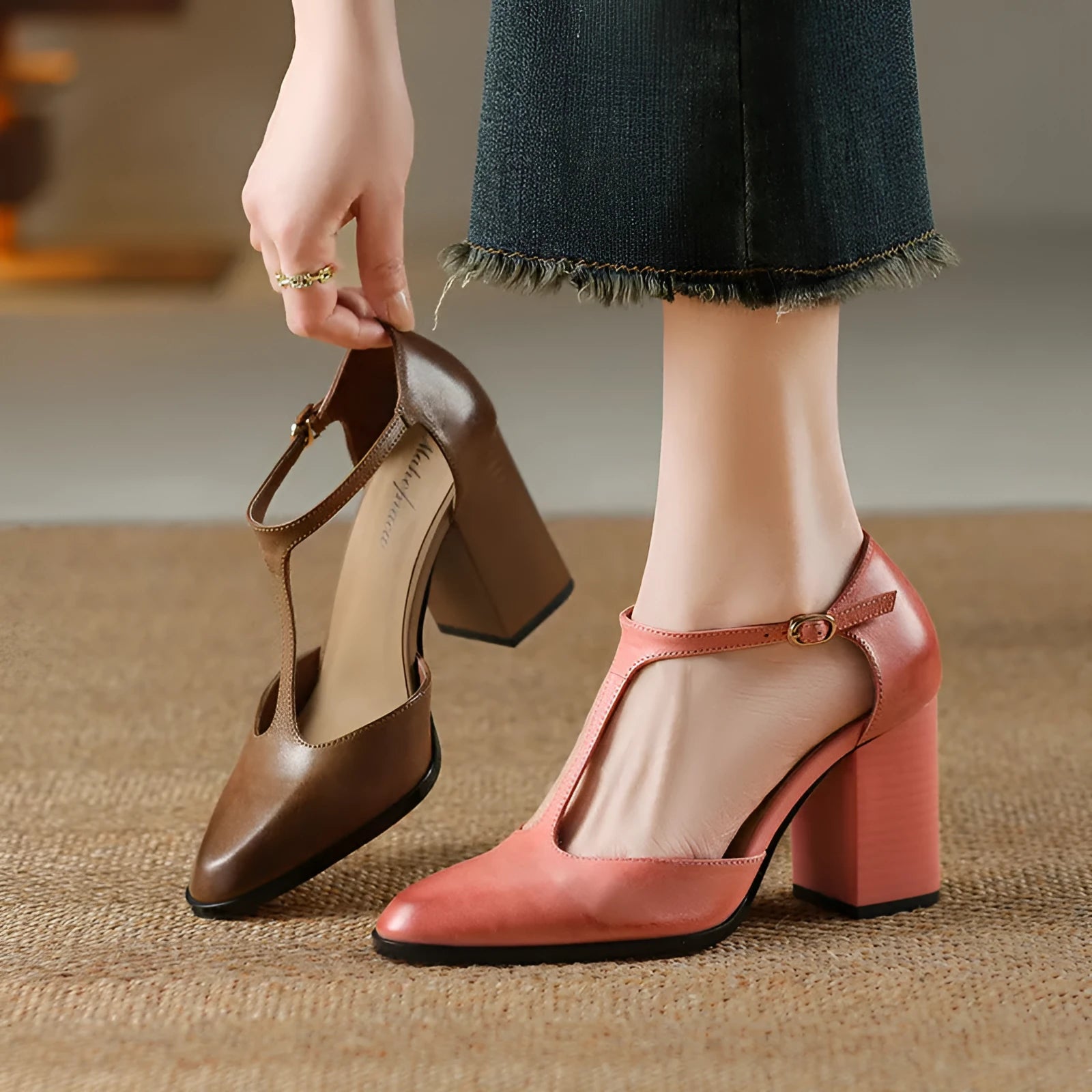 Women's retro Mary Jane shoes with pointed toe, hollow design and buckle fastening in pink or dark brown.