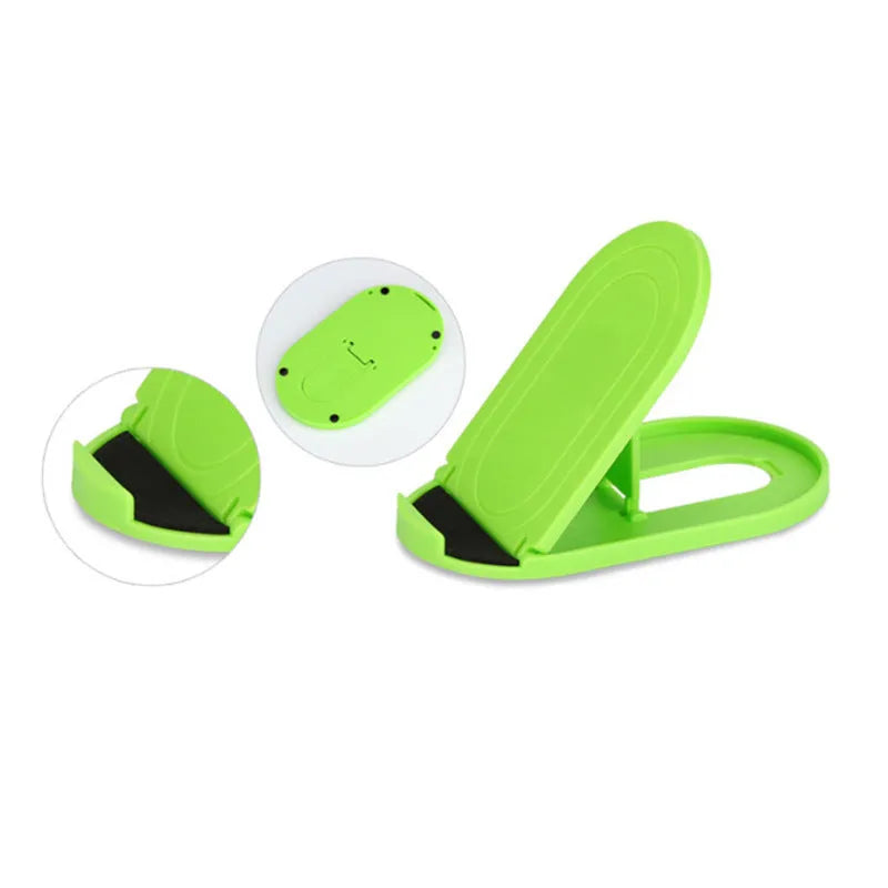 Plastic adjustable bracket mobile phone stand in six colour choices on a desk.