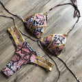 Female bronzing bikini swimwear with soft padding, shown in multiple colour and print options.