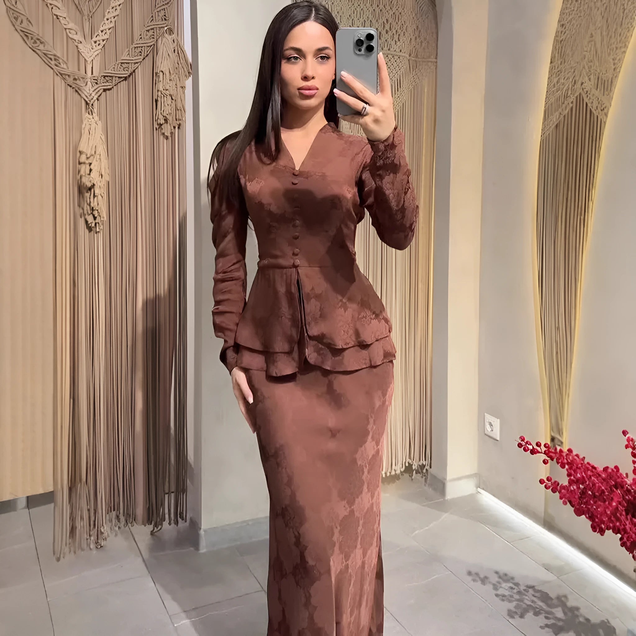 Women's dark brown artistic retro dress with plant pattern and button detailing showing long sleeves and fake two-piece styling