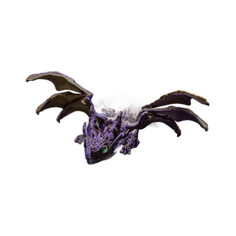 3D printed red and gold flying dragon wings decoration toy on a white background.