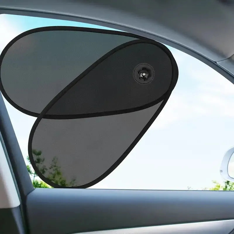 Black stretchy car window shade with suction cups attached to vehicle side window