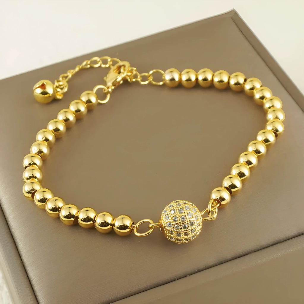 Women's copper bracelet with zircon Arabic styling and heart-shaped pendant on wrist