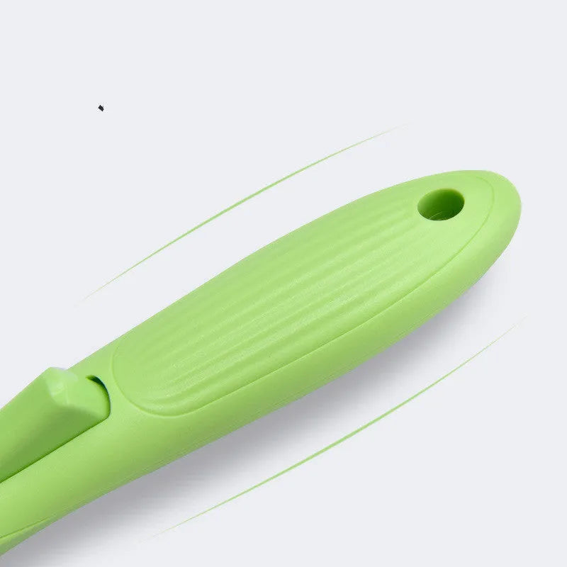 Fruit green automatic pet hair removal brush with ABS and TRP handle on white background