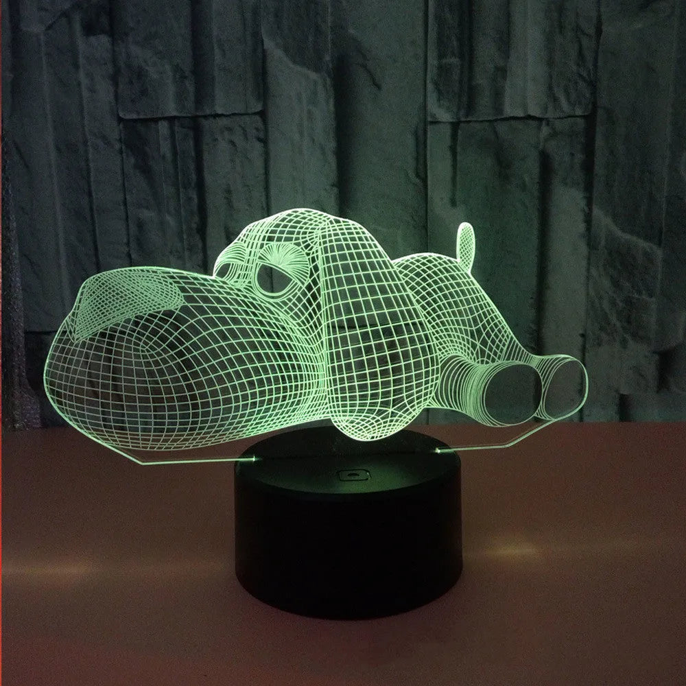 Dog-shaped desktop lamp glowing in blue, with touch button and USB cable.