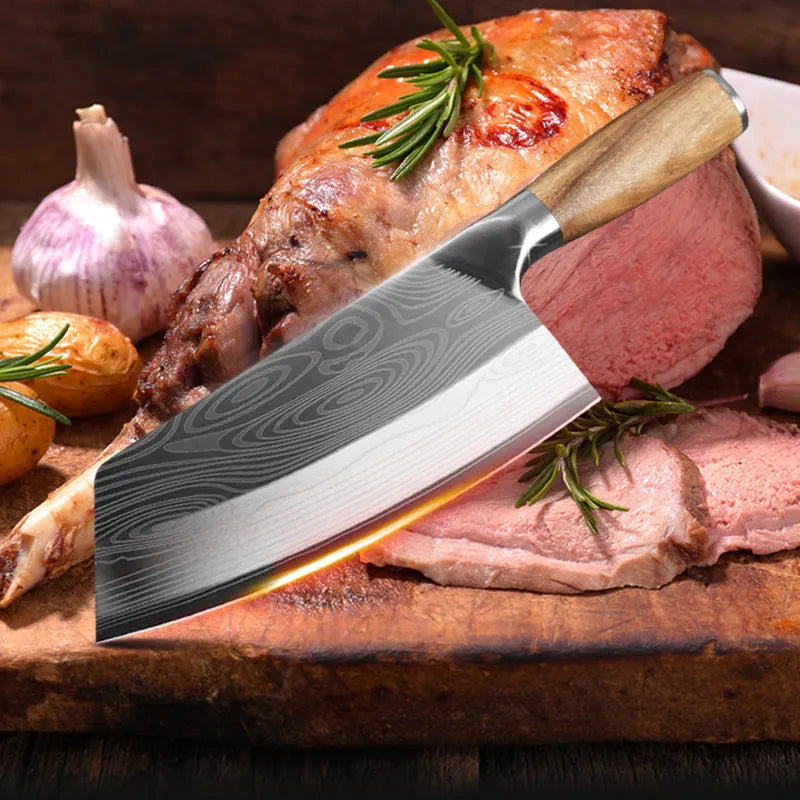 Stainless steel kitchen knife with a 320mm blade on a wooden cutting board.