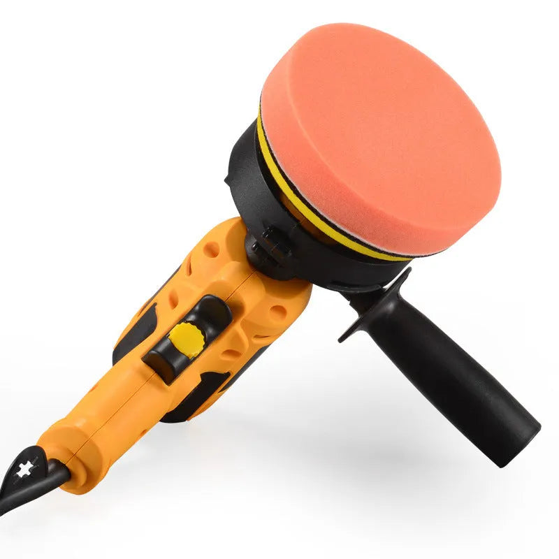 Yellow automotive polishing machine with 125mm disc diameter on workbench