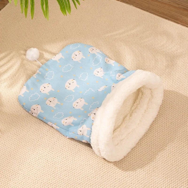 Flannel cat sleeping bag pet bed in pink Trojan pattern, 50cm by 40cm.