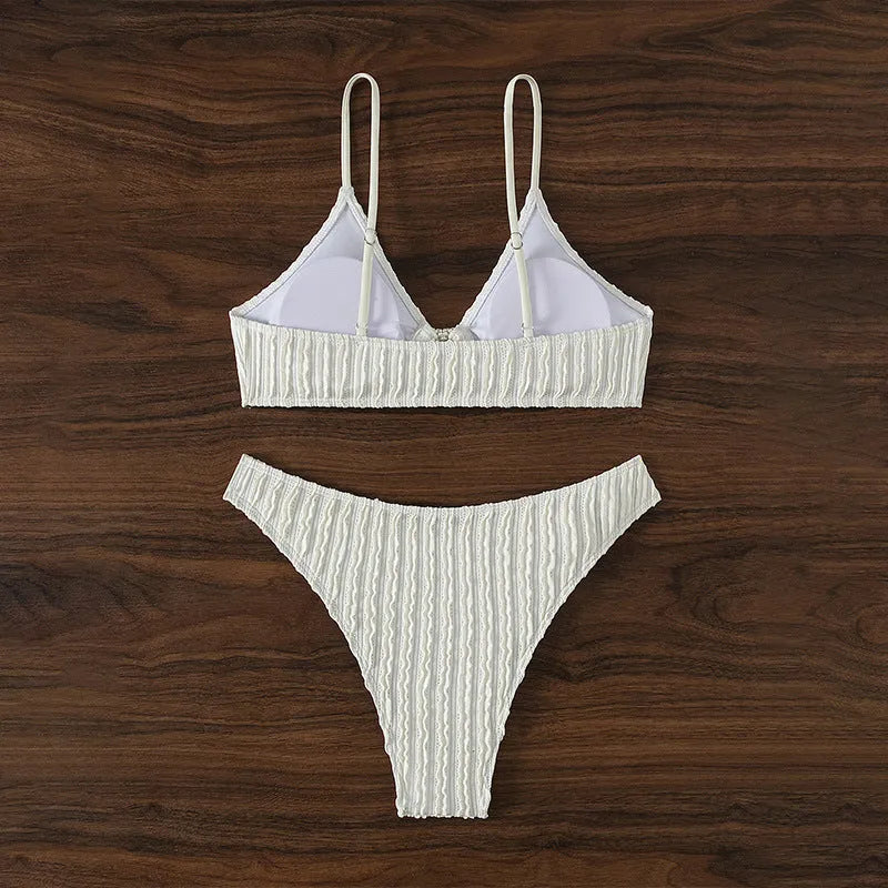 White women's V-neck beach swimsuit with sleeveless design and split cut