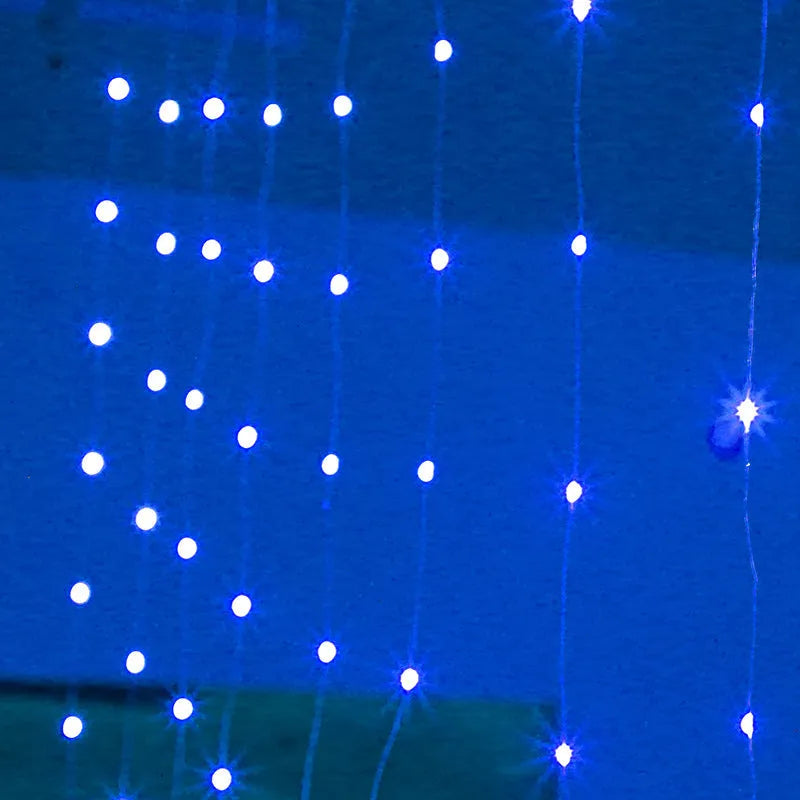 Copper curtain fairy lights with multiple LED beads, showing blue, purple, and white colour options hung in a decorative drape.