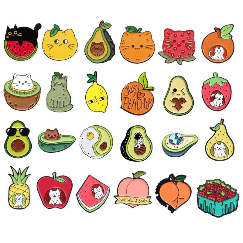 Colourful cartoon fruit design zinc alloy brooch pin on a fabric background.