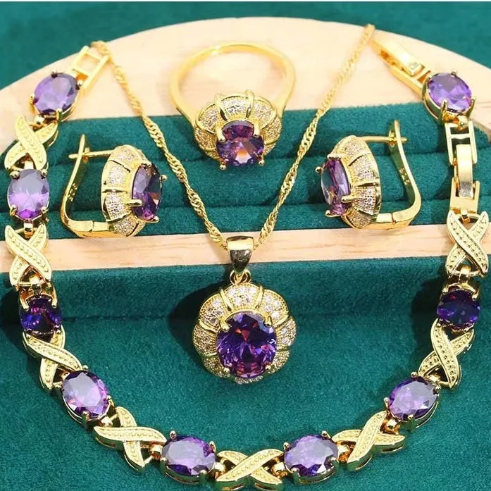 Complete 18k gold plated jewellery set with colourful zircon stones, showing necklace, earrings, ring, and bracelet.