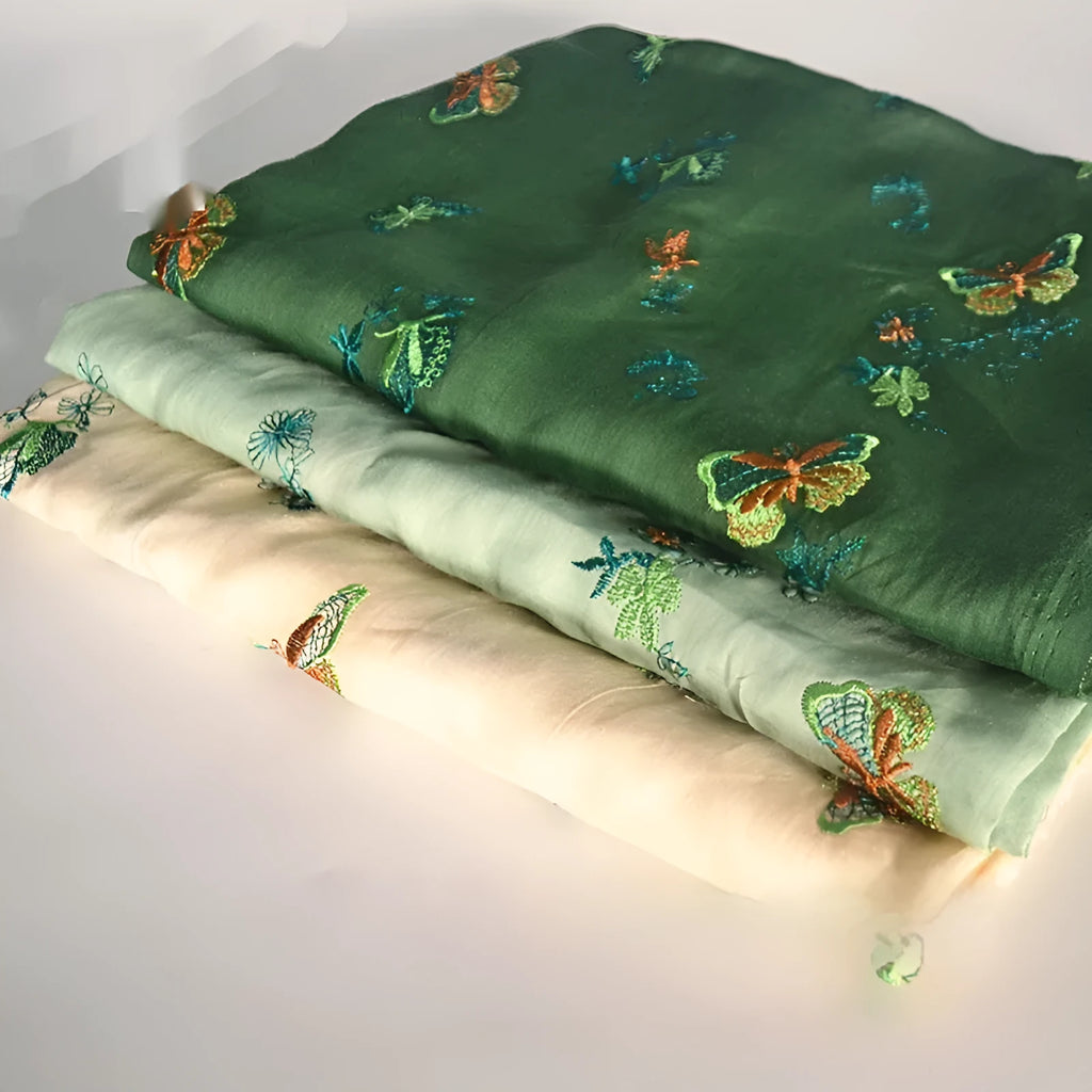 Pure ramie embroidery cloth hanfu fabric in beige, dark green, or grass green, showing texture.