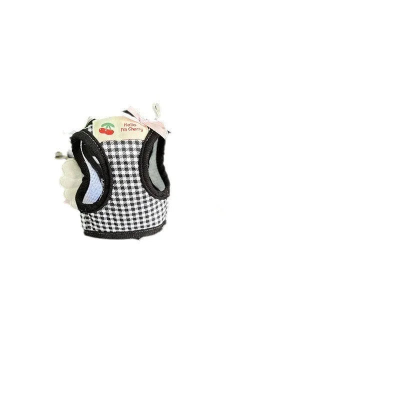 Small dog wearing pink cotton chest and back harness with adjustable straps