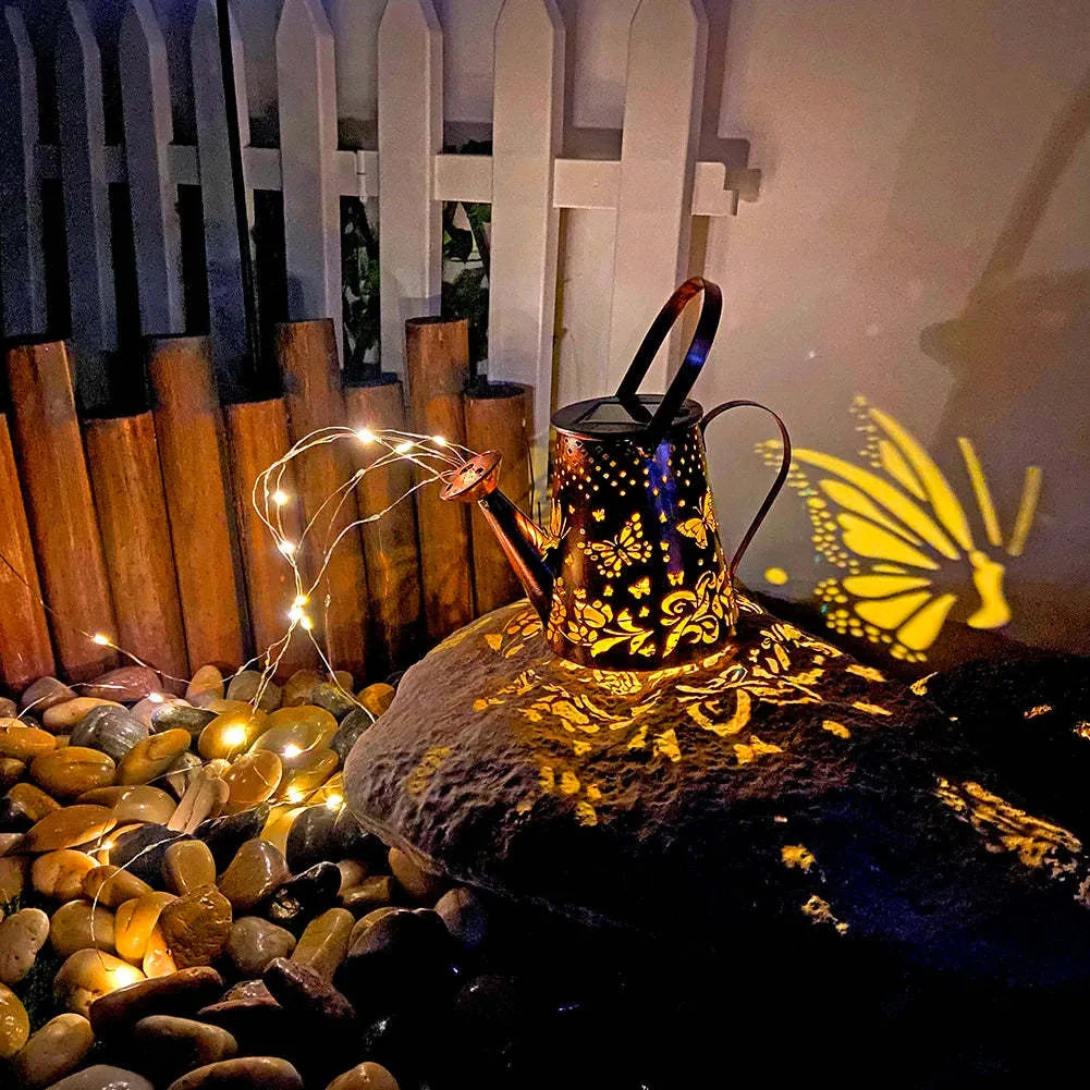 Solar garden lamp with tapered butterfly pattern design in iron construction