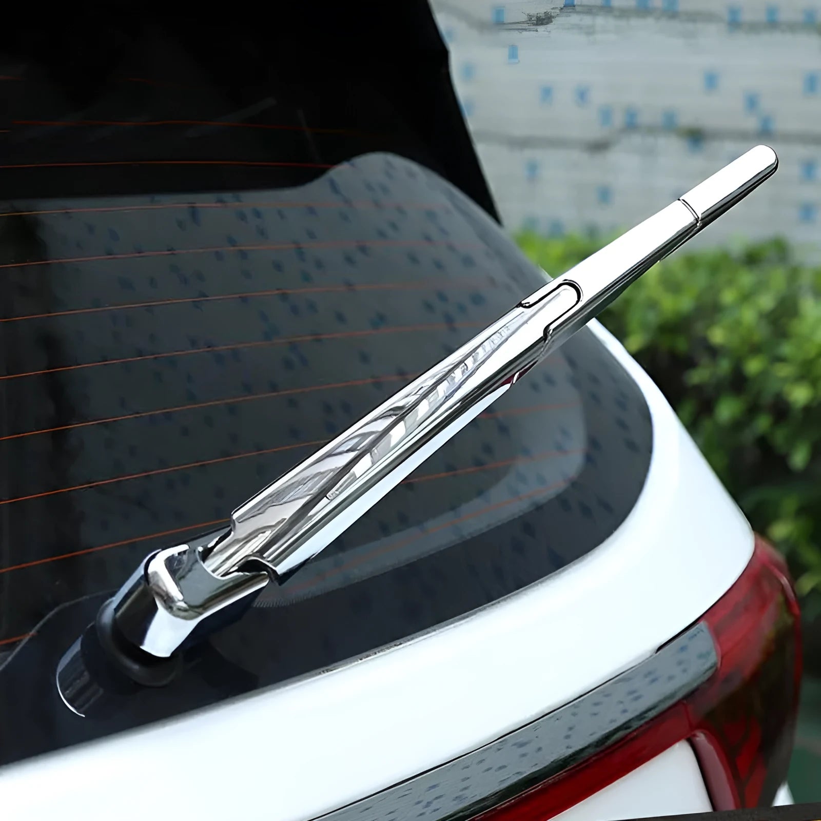 Set of four silvery ABS plastic rear window wiper cover trims for a 2010 Hyundai