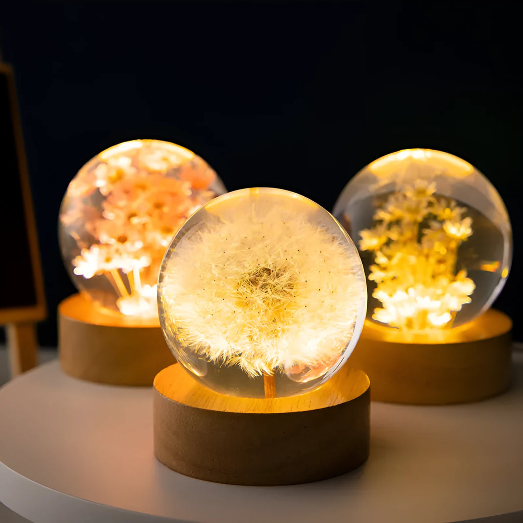 3D dandelion eternal flower inside a luminous resin crystal ball on a beech wood stand base.